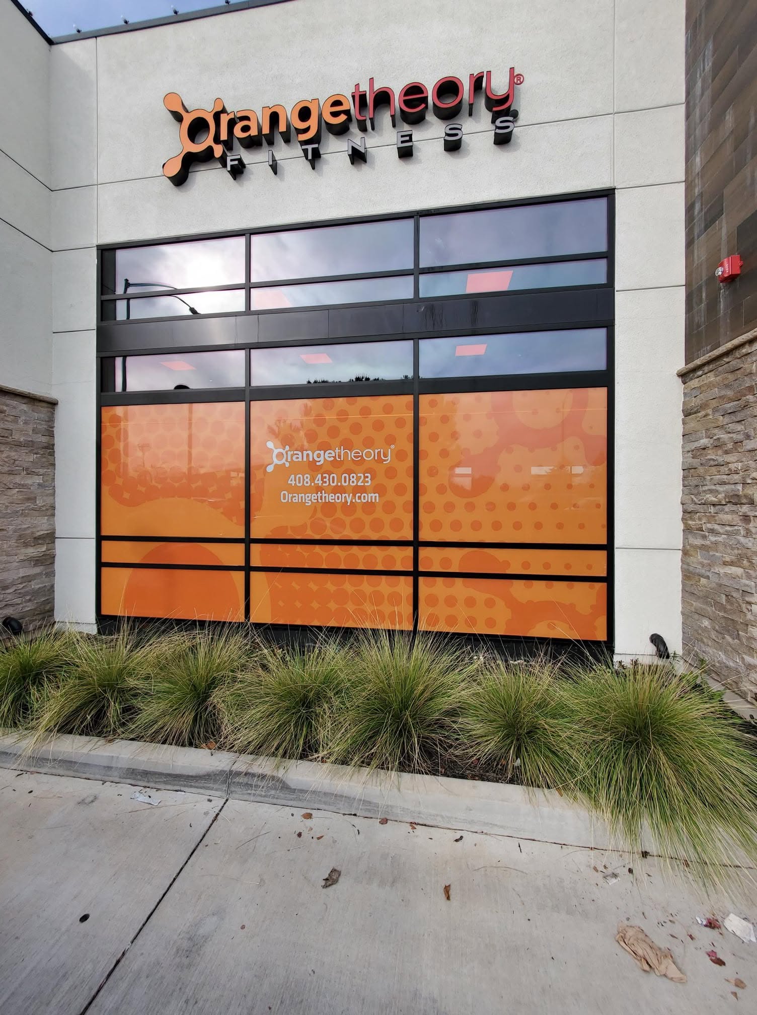 Multi-panel Orangetheory Fitness storefront graphics
